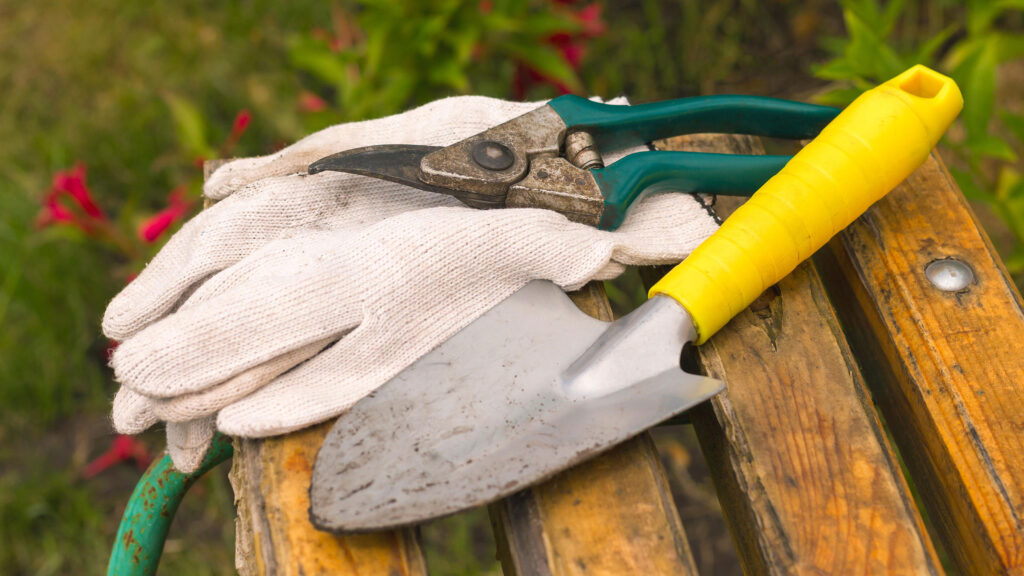 worked dirty garden tools composition laying on a bench Smith County Master Gardeners Cleaning your garden tools